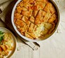 Cheesy potato patchwork pie in a baking dish