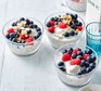 Bowls of chia and almond overnight oats topped with berries