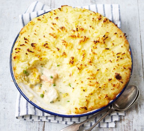 Fish pie topped with mash with a chunk missing