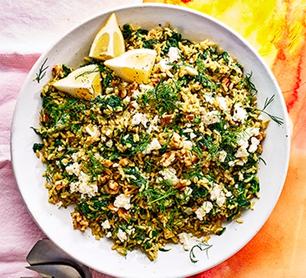 Lemon & spinach rice with feta in a white bowl