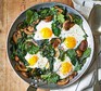 Mushroom, eggs and kale in a pan