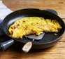 A frying pan serving an omelette