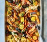 One-pan seafood roast with smoky garlic butter served in a roasting tray