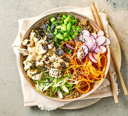 Ponzu tofu poke bowl with fresh vegetables and chopsticks