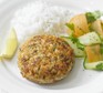 Superhealthy salmon burgers with white rice and a ribbon salad on the side