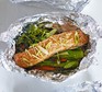 Teriyaki salmon with vegetables in foil parcels