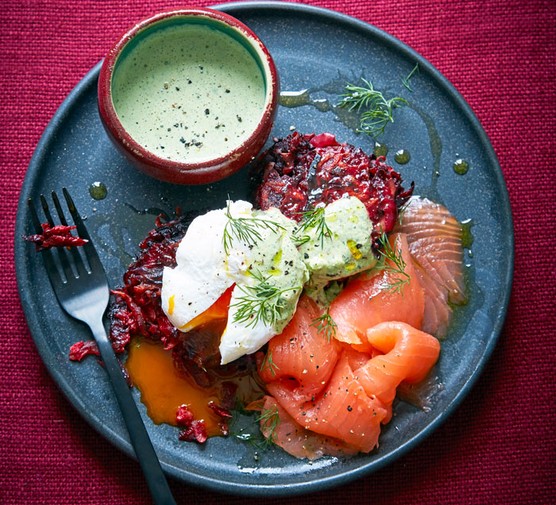 Smoked salmon, beetroot rosti and eggs on a plate