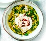 Spinach dhal with harissa yogurt served in a bowl