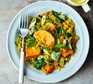 Spinach, sweet potato and lentil dhal with fork on plate