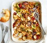 Healthy sausage traybake served in a casserole dish