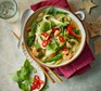 Thai curry noodle soup served in a bowl