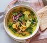 Light summer tofu curry with onion and coriander served in a bowl