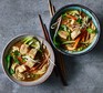 Two bowls of vegan ramen with chopsticks
